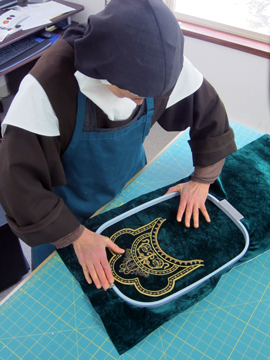 Placing embroidery in the hoop for the machine