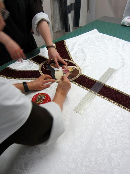 Placing the applique on the vestment