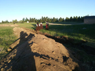 Sisters looking at the new building grounds site