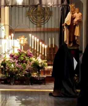 Sister adoring the Blessed Sacrament